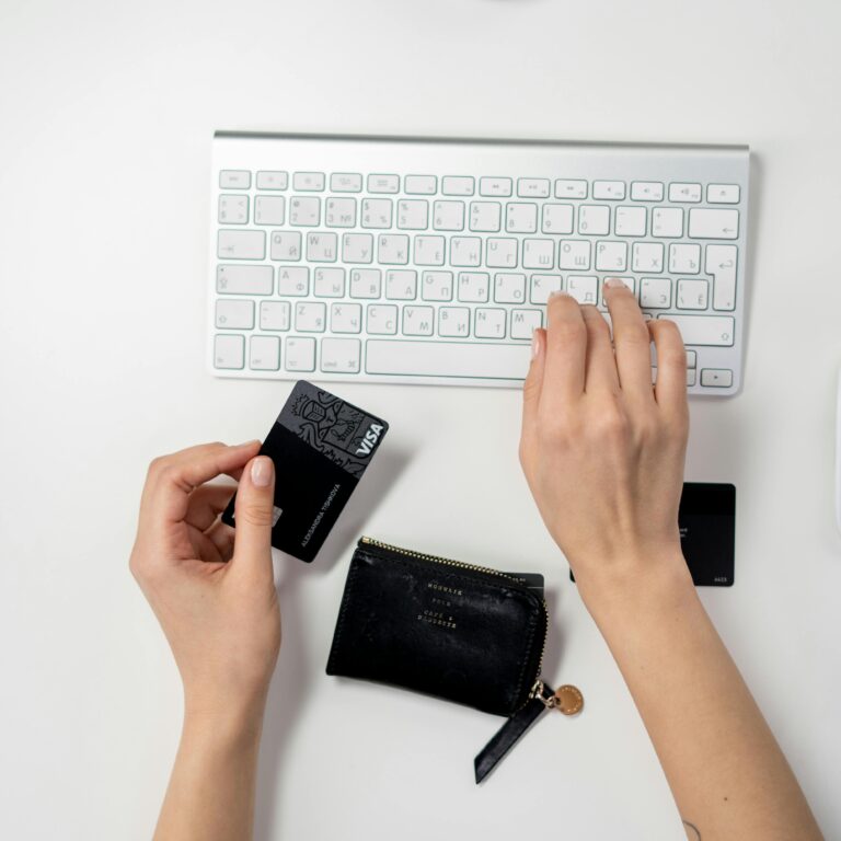 E-commerce setup featuring a keyboard, card, and wallet, ideal for online shopping concepts.
